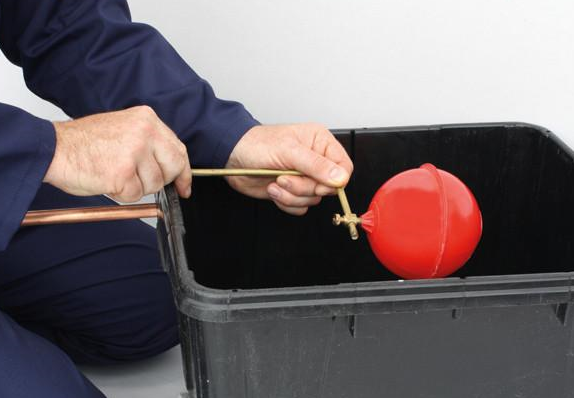 A float operated valve being fitted to a cistern