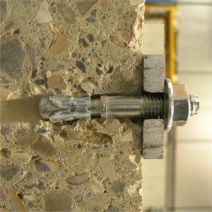 An expansion anchor set into concrete