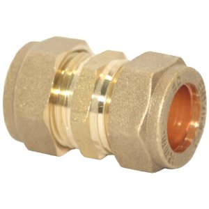 A brass compression coupling cut away to show the olive