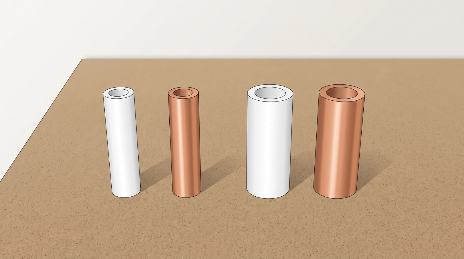 Four short offcuts standing on end: 15 mm plastic and copper pipe, then 22 mm plastic and copper pipe, each plastic pipe the same outside size as the copper beside it